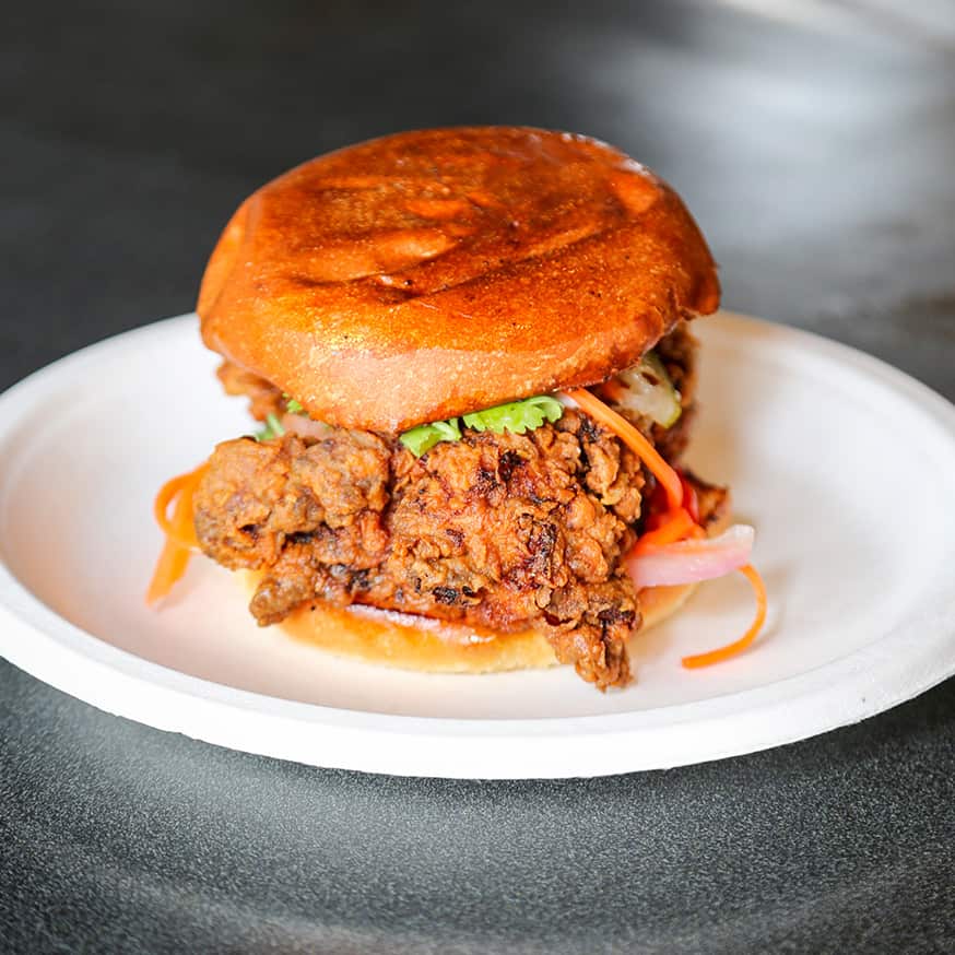 Fried Chicken Sandwich with seasonal pickled vegetables and spicy aioli at the Bodega Food Truck in Teton Village, Wyoming.