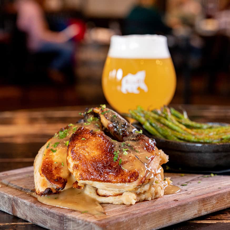 Fried Duck Wings with an apricot ginger glaze, spicy chinese mustard, and grilled asparagus at the Roadhouse Pub & Eatery in Jackson, Wyoming.