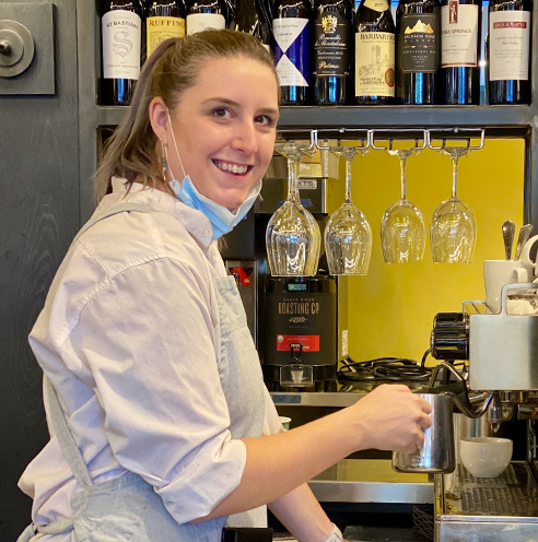 Portrait of Fine Dining Restaurant Group front of house employee of the month, Lilly Casey, in the kitchen of The Bistro Restaurant in Jackson, Wyoming.