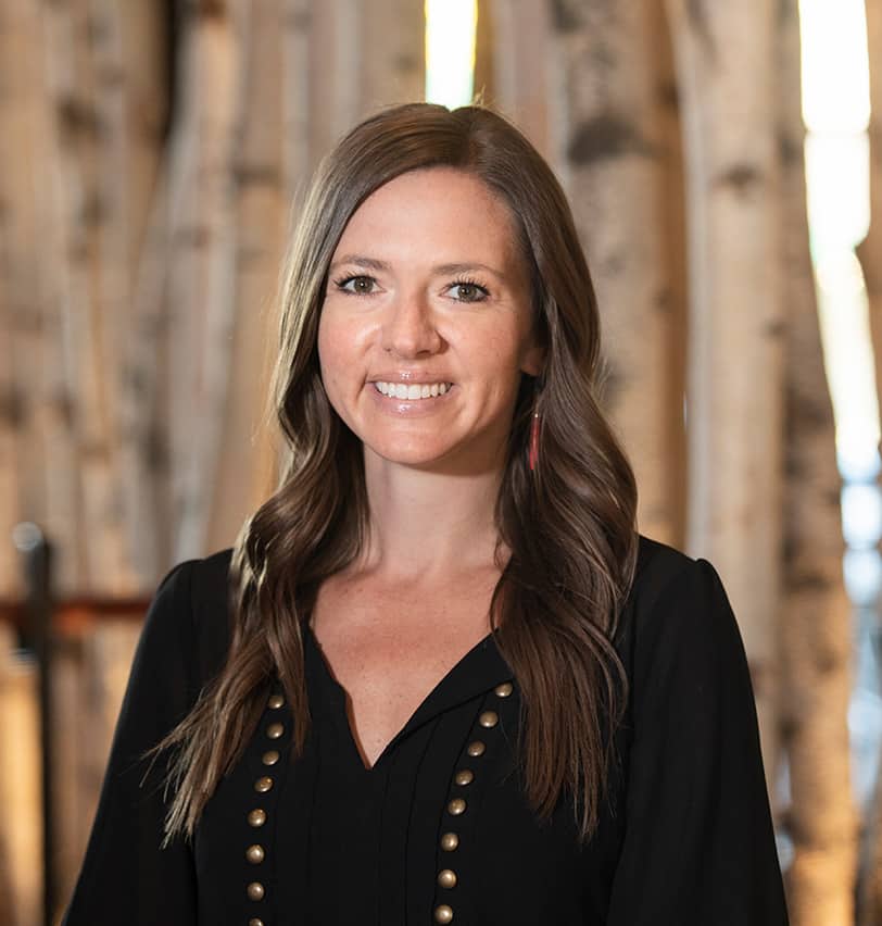 Portrait of Fine Dining Restaurant Group Director of Accounting, Megan Hopkins, in the dining room of The Bistro restaurant in Jackson, Wyoming.