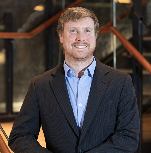 Portrait of Fine Dining Restaurant Group’s Vice President of Business Development, Park Dunn-Morrison, standing outside a Fine Dining restaurant in Jackson Hole.