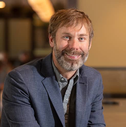 Portrait of Fine Dining Restaurant Group Chief Operating Officer, Justin Henry in the lobby of The Bistro restaurant in Jackson, Wyoming.