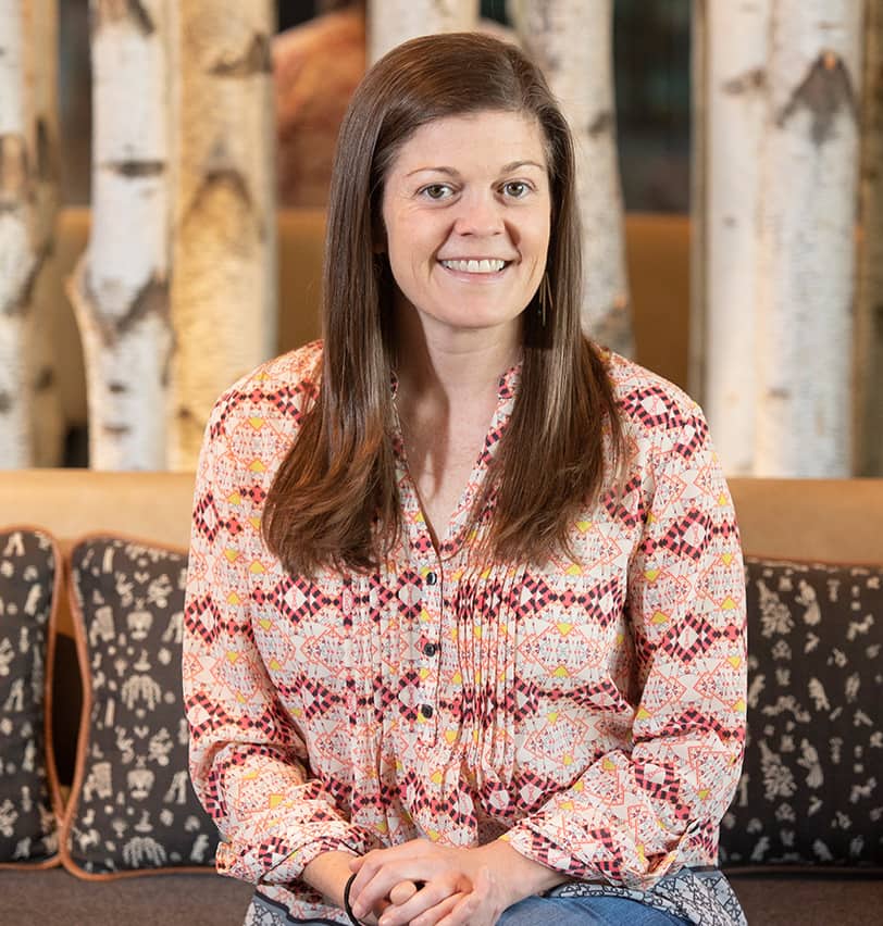 Portrait of Fine Dining Restaurant Group Director of Culture, Kate Fatter, in the dining room of a Fine Dining restaurant in Jackson, Wyoming.