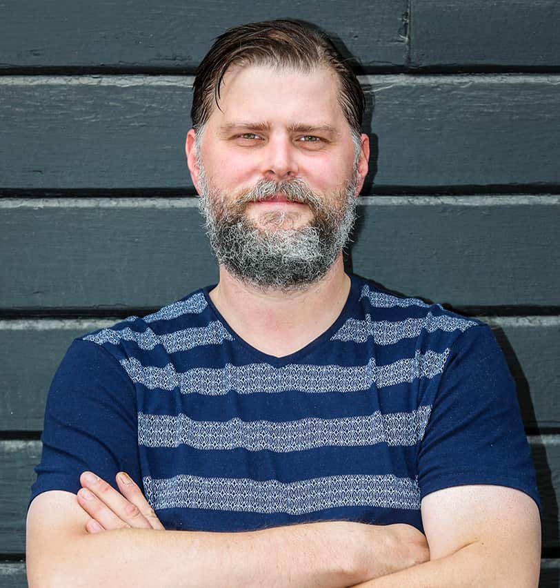 Portrait of Fine Dining Restaurant Group Executive Pastry Chef, Chad Horton, outside a bakery in Jackson, Wyoming.