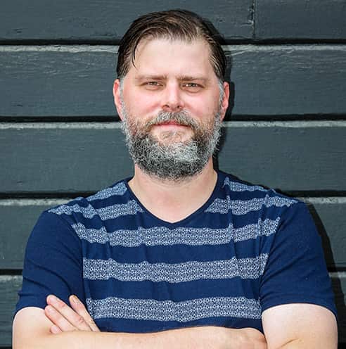 Portrait of Fine Dining Restaurant Group Executive Pastry Chef, Chad Horton, outside a bakery in Jackson, Wyoming.