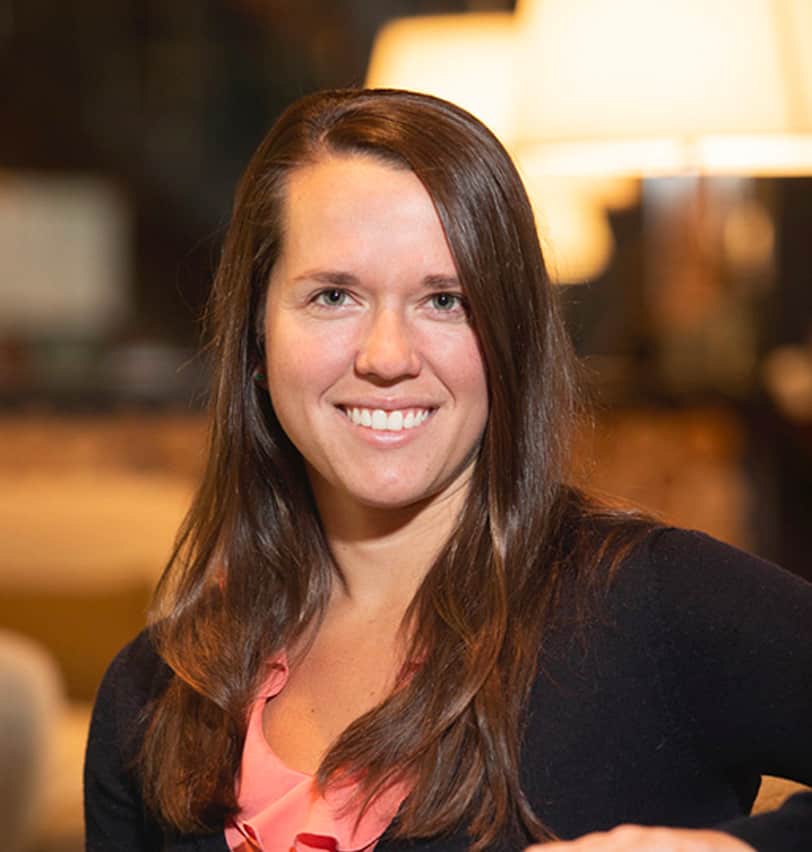 Portrait of Fine Dining Restaurant Group Director of Systems & Analytics, Kari Rak, in the lobby of The Cloudveil Hotel in Jackson.