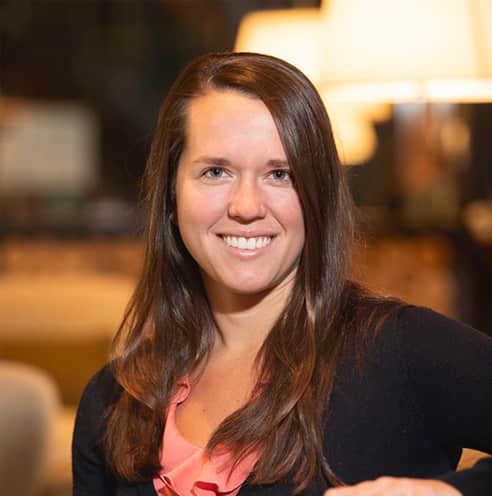 Portrait of Fine Dining Restaurant Group Director of Systems & Analytics, Kari Rak, in the lobby of The Cloudveil Hotel in Jackson.